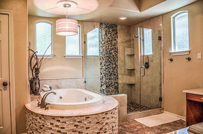 This is an example of a large traditional ensuite bathroom in Houston with medium wood cabinets, a built-in bath, a corner shower, beige tiles, porcelain tiles, beige walls, ceramic flooring, a built-in sink and a hinged door.