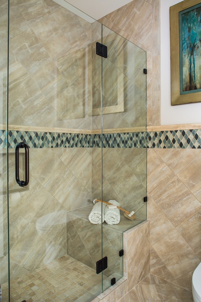 Alcove shower - mid-sized transitional master blue tile, gray tile, white tile and glass tile medium tone wood floor alcove shower idea in Atlanta with a one-piece toilet, beige walls, an undermount sink and solid surface countertops