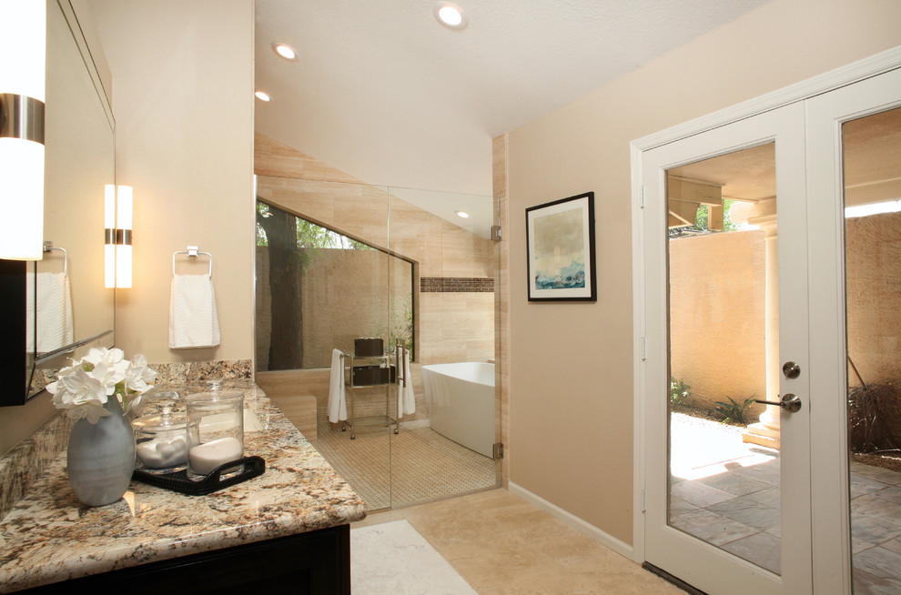 Idées déco pour une salle de bain principale classique en bois foncé de taille moyenne avec une baignoire indépendante, un espace douche bain, un mur beige, un lavabo encastré, un plan de toilette en granite et une cabine de douche à porte battante.