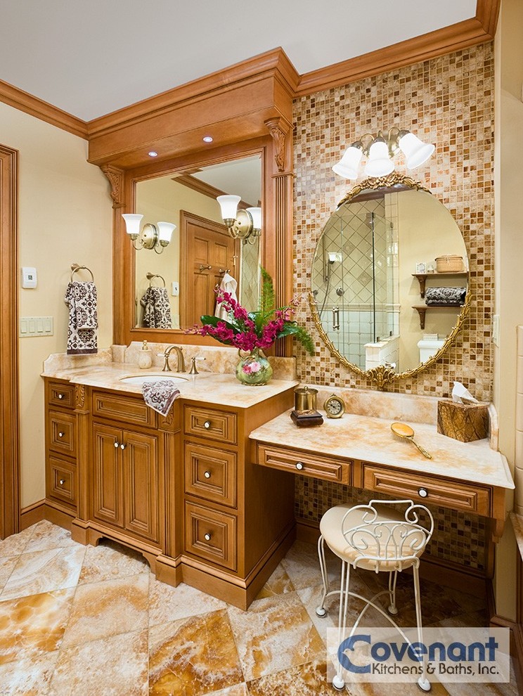 Ejemplo de cuarto de baño clásico con lavabo encastrado, armarios tipo mueble, puertas de armario de madera oscura, encimera de ónix, baldosas y/o azulejos beige, baldosas y/o azulejos en mosaico y paredes beige