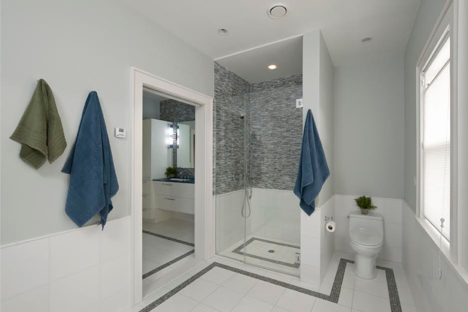 This is an example of a medium sized contemporary bathroom in Providence with flat-panel cabinets, white cabinets, an alcove shower, blue tiles, white tiles, matchstick tiles, blue walls, ceramic flooring, a submerged sink and a freestanding bath.