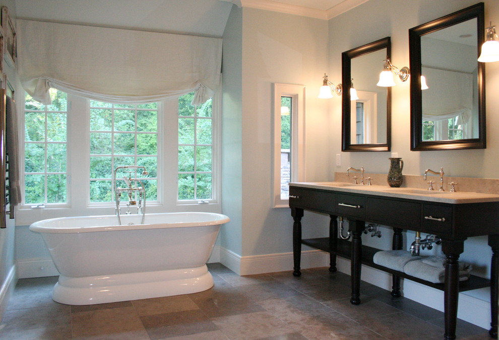 Inspiration for a timeless freestanding bathtub remodel in Atlanta with a console sink and marble countertops