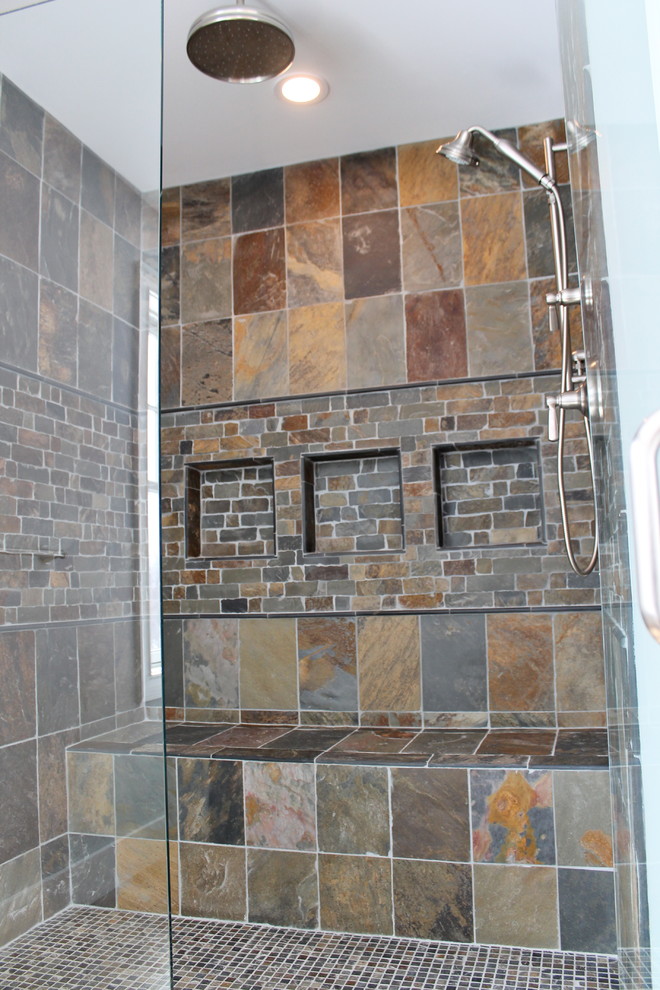 Example of a trendy master multicolored tile and stone tile slate floor alcove shower design in New York