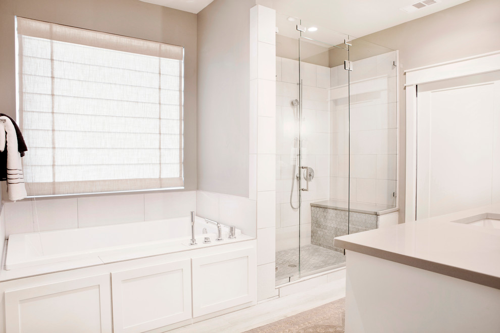 Inspiration for a medium sized traditional ensuite bathroom in Austin with shaker cabinets, white cabinets, porcelain tiles, grey walls, a submerged sink, engineered stone worktops, a built-in bath, a corner shower, beige tiles, porcelain flooring, beige floors, a hinged door and grey worktops.