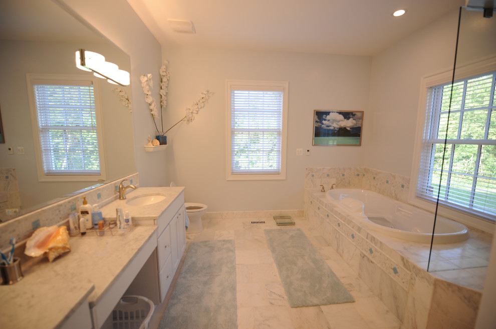 Drop-in bathtub - eclectic drop-in bathtub idea in DC Metro with white cabinets and an undermount sink