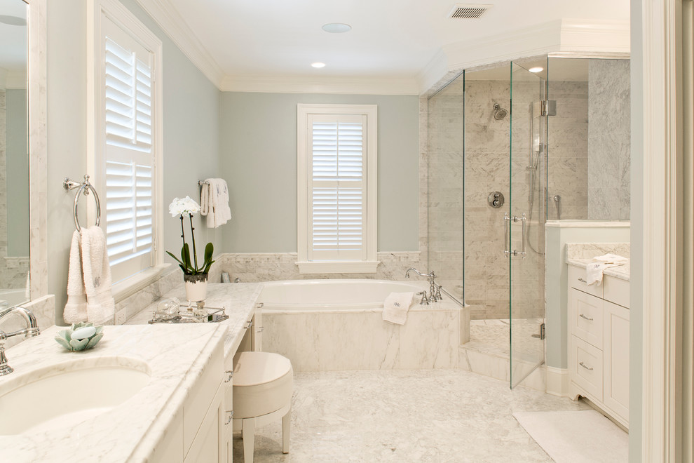 Inspiration for a large timeless master gray tile and marble tile porcelain tile and gray floor bathroom remodel in DC Metro with recessed-panel cabinets, white cabinets, blue walls, an undermount sink, marble countertops and a hinged shower door