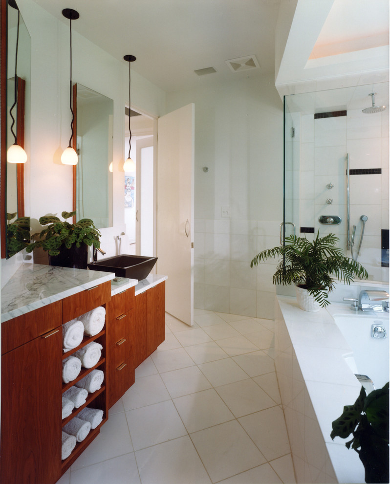 Large modern ensuite bathroom in DC Metro with a trough sink, flat-panel cabinets, light wood cabinets, granite worktops, a hot tub, an alcove shower, white tiles, ceramic tiles, white walls and ceramic flooring.