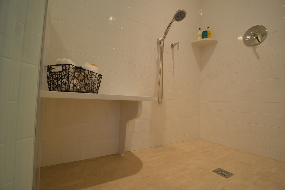 Example of a mid-sized classic white tile and subway tile porcelain tile corner shower design in New York with quartz countertops
