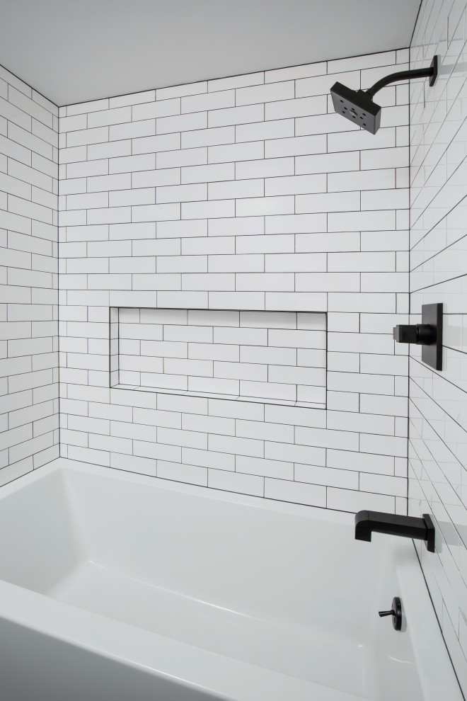 Inspiration for a medium sized contemporary ensuite bathroom in Boston with an alcove bath, white tiles, metro tiles, white walls, ceramic flooring and grey floors.