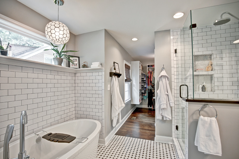 Example of a mid-sized minimalist master white tile and ceramic tile ceramic tile and white floor bathroom design in Atlanta with furniture-like cabinets, brown cabinets, a one-piece toilet, beige walls, an undermount sink, solid surface countertops and a hinged shower door