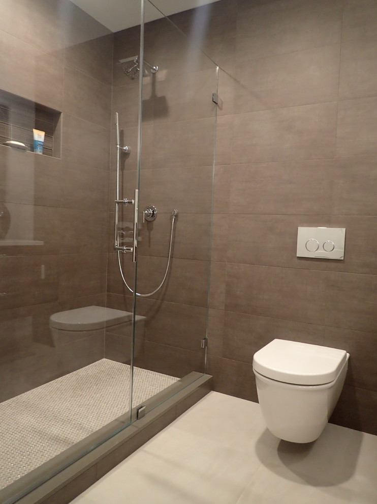 Design ideas for a medium sized modern shower room bathroom in New York with a submerged sink, flat-panel cabinets, dark wood cabinets, engineered stone worktops, an alcove shower, a wall mounted toilet, multi-coloured tiles, porcelain tiles, brown walls and porcelain flooring.