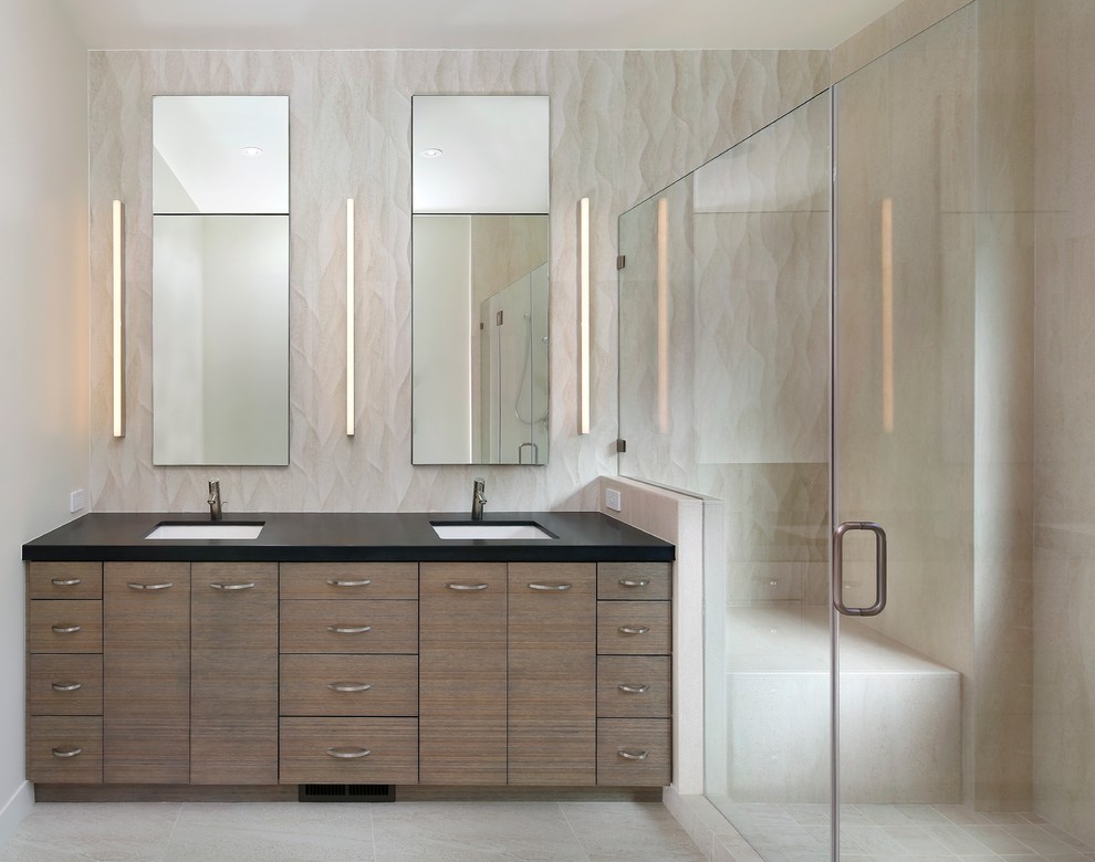 Example of a minimalist bathroom design in San Francisco with dark wood cabinets