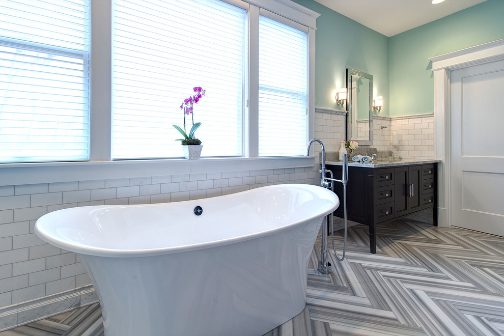 Large trendy master white tile and marble tile gray floor and marble floor bathroom photo in St Louis with blue walls, an undermount sink, a two-piece toilet, a hinged shower door, furniture-like cabinets, medium tone wood cabinets, marble countertops and gray countertops