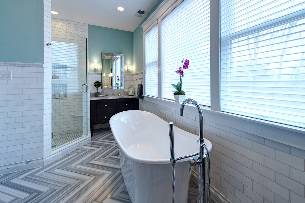Bathroom - large contemporary master white tile and marble tile gray floor and marble floor bathroom idea in St Louis with blue walls, an undermount sink, a hinged shower door, a two-piece toilet, furniture-like cabinets, medium tone wood cabinets, marble countertops and gray countertops