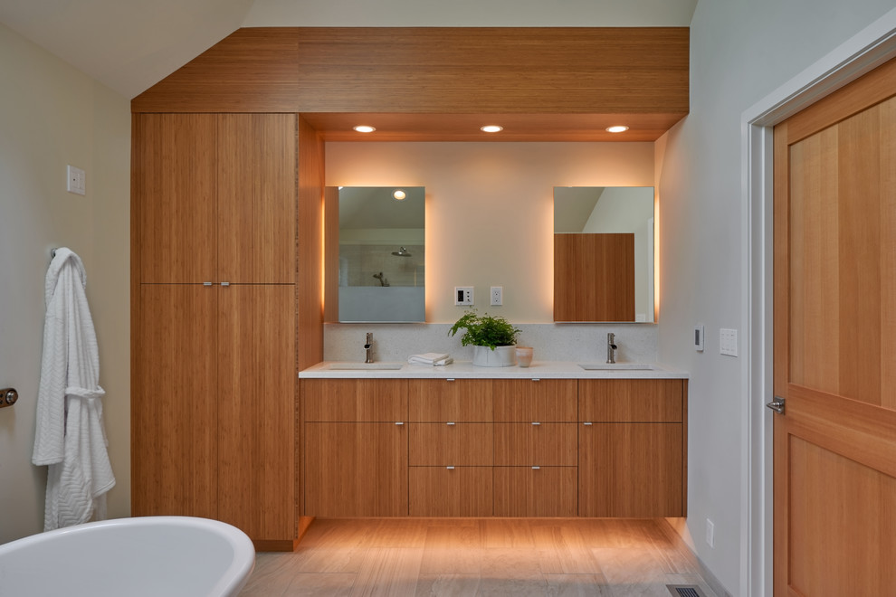Example of a mid-sized transitional master white tile and porcelain tile porcelain tile bathroom design in Seattle with flat-panel cabinets, medium tone wood cabinets, a one-piece toilet, white walls, an undermount sink and quartz countertops