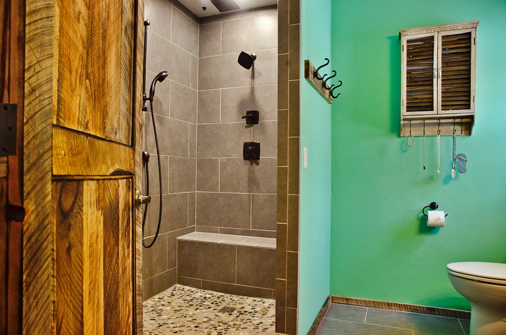 Photo of a medium sized rustic ensuite bathroom in Other with an alcove shower, a two-piece toilet, green walls, ceramic flooring, brown floors and an open shower.