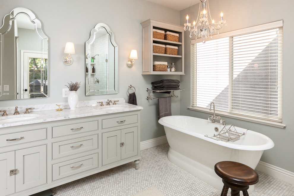 Mid-sized eclectic master gray tile and stone tile marble floor bathroom photo in Other with shaker cabinets, gray cabinets, a two-piece toilet, gray walls, a console sink and marble countertops