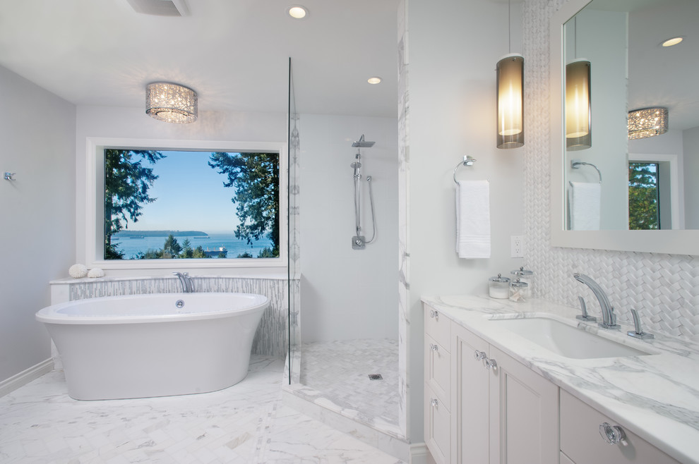 Inspiration for a large contemporary gray tile and stone tile mosaic tile floor bathroom remodel in Vancouver with an undermount sink, recessed-panel cabinets, white cabinets, marble countertops and white walls