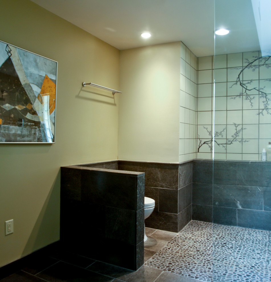 Design ideas for a large world-inspired ensuite bathroom in Cedar Rapids with open cabinets, light wood cabinets, a walk-in shower, beige tiles, ceramic tiles, white walls, ceramic flooring, an integrated sink, granite worktops, black floors and an open shower.