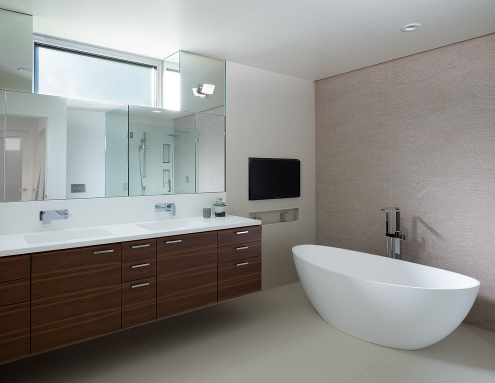 Freestanding bathtub - mid-sized modern master gray tile and porcelain tile porcelain tile and gray floor freestanding bathtub idea in San Francisco with flat-panel cabinets, white walls, an integrated sink and solid surface countertops