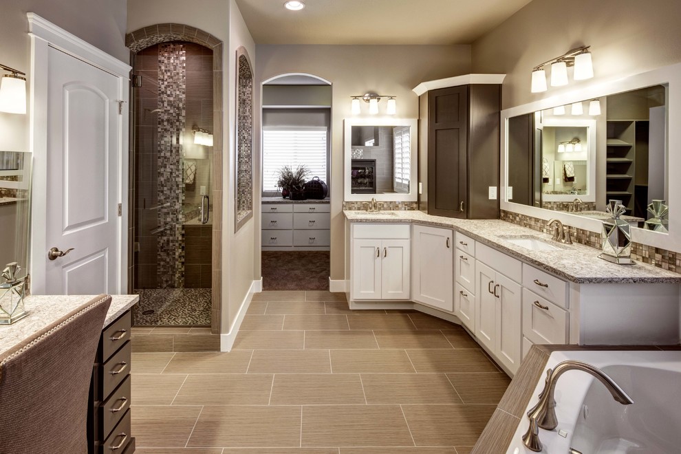 Mid-sized elegant master beige tile and ceramic tile ceramic tile and beige floor bathroom photo in Salt Lake City with an undermount sink, flat-panel cabinets, white cabinets, granite countertops, beige walls and a hinged shower door