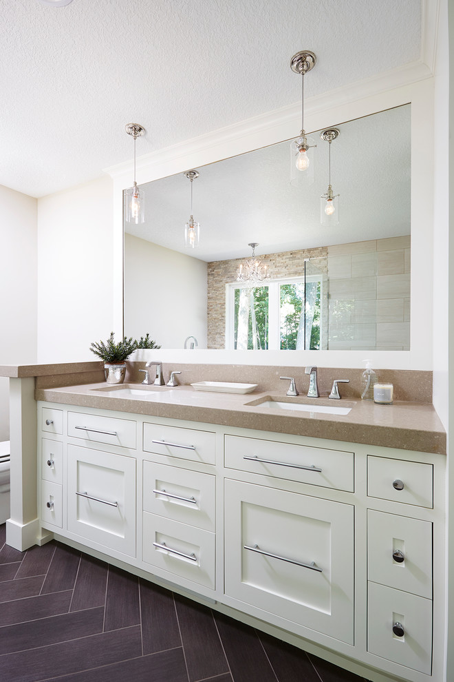 Inspiration for a large timeless master vinyl floor bathroom remodel in Minneapolis with shaker cabinets, white cabinets, a one-piece toilet, beige walls and an undermount sink