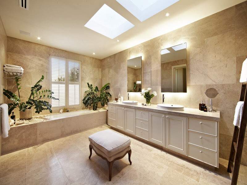 Corner bathtub - mid-sized contemporary master beige tile and limestone tile marble floor and beige floor corner bathtub idea in Brisbane with open cabinets, beige walls and limestone countertops