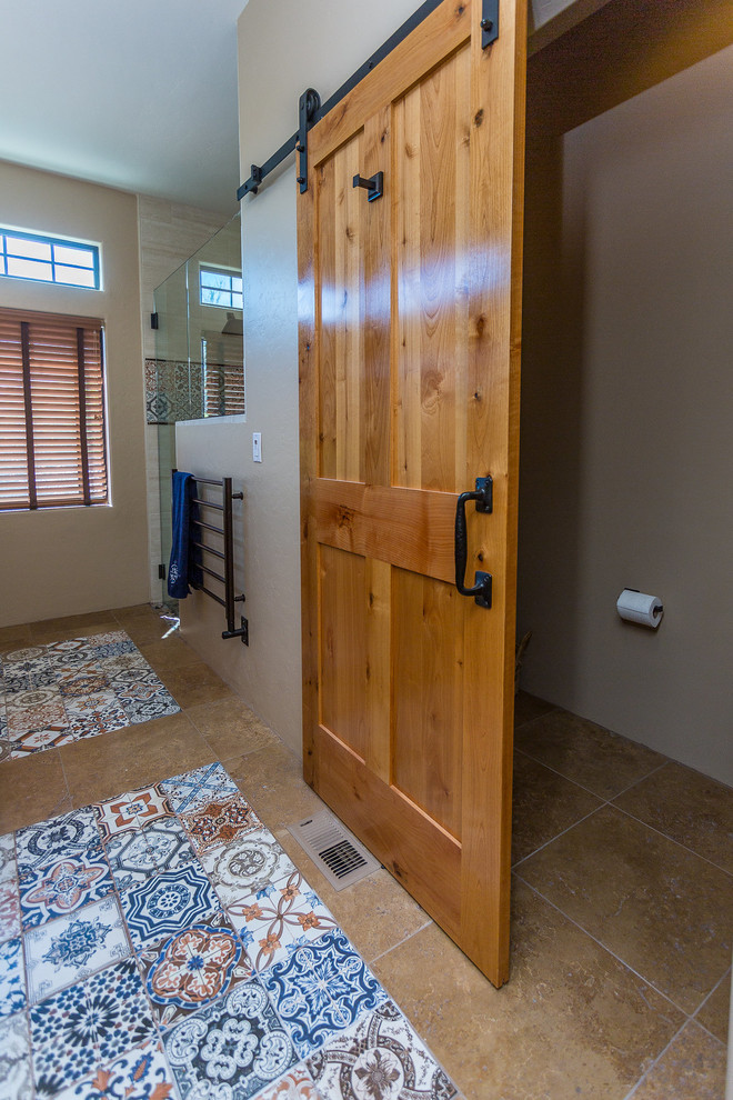 This is an example of a large shower room bathroom in Phoenix with recessed-panel cabinets, medium wood cabinets, a corner shower, beige tiles, beige walls, travertine flooring, a submerged sink, engineered stone worktops, brown floors and a hinged door.