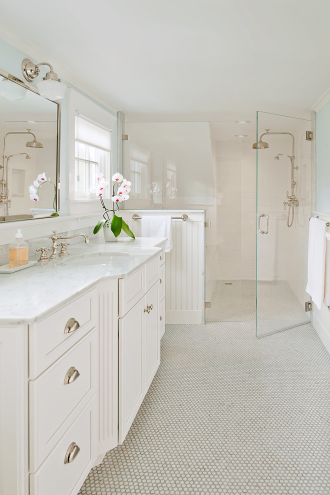 Example of a trendy mosaic tile floor walk-in shower design in Boston with marble countertops and white cabinets