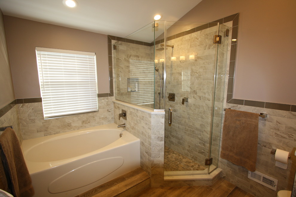 Inspiration for a large contemporary master beige tile and stone tile ceramic tile and multicolored floor bathroom remodel in New York with shaker cabinets, brown cabinets, a one-piece toilet, beige walls, a vessel sink, quartz countertops and a hinged shower door