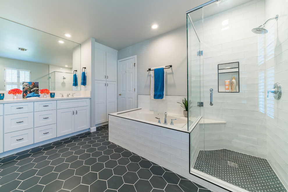 Large modern ensuite bathroom in Miami with shaker cabinets, white cabinets, a japanese bath, an alcove shower, a one-piece toilet, white tiles, metro tiles, grey walls, mosaic tile flooring, a console sink, marble worktops, grey floors, a hinged door and white worktops.