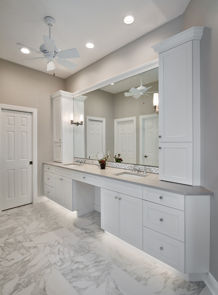 This is an example of a large classic ensuite bathroom in Miami with recessed-panel cabinets, white cabinets, a submerged bath, a built-in shower, grey walls, marble flooring, a submerged sink, engineered stone worktops and an open shower.
