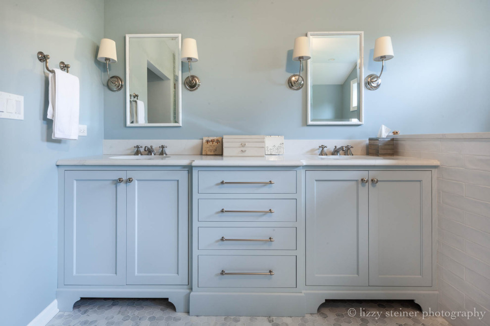 Large traditional ensuite bathroom in Chicago with freestanding cabinets, blue cabinets, a freestanding bath, an alcove shower, blue tiles, blue walls, marble flooring, engineered stone worktops, grey floors and a hinged door.