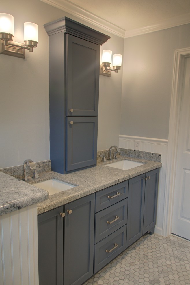 Small classic ensuite bathroom in Houston with shaker cabinets, blue cabinets, blue walls, mosaic tile flooring, a submerged sink, granite worktops, white floors and white worktops.