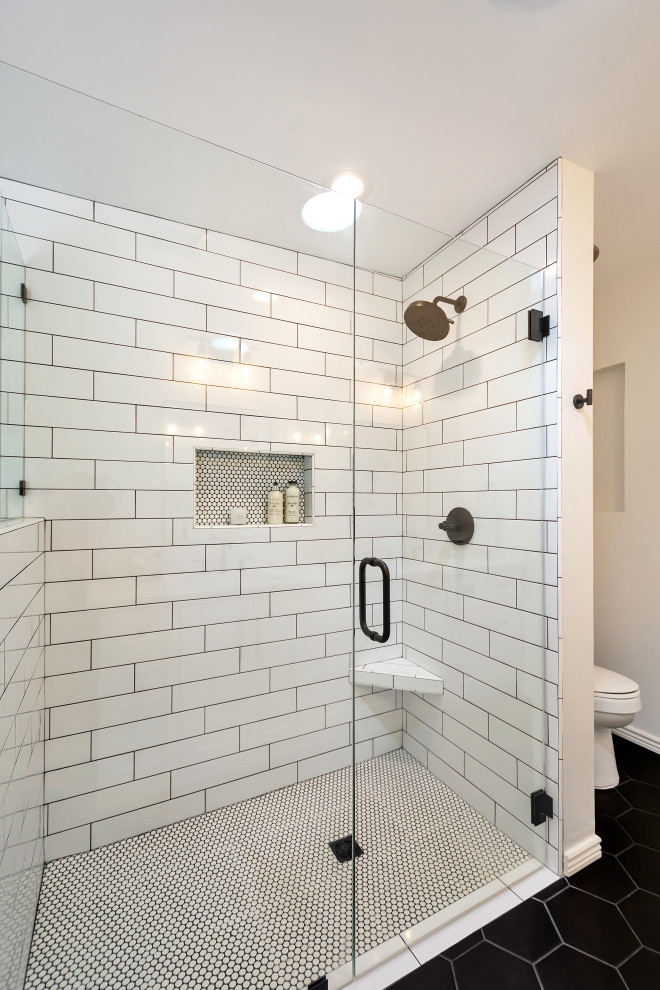 Medium sized classic ensuite bathroom in Phoenix with shaker cabinets, white cabinets, a freestanding bath, a built-in shower, white tiles, metro tiles, porcelain flooring, a submerged sink, engineered stone worktops, black floors, a hinged door, white worktops, a wall niche, double sinks and a built in vanity unit.