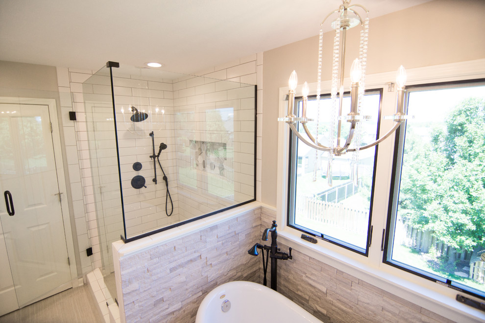 Inspiration for a mid-sized timeless master beige tile and stone tile porcelain tile and beige floor bathroom remodel in Kansas City with recessed-panel cabinets, white cabinets, a two-piece toilet, beige walls, an undermount sink, granite countertops and a hinged shower door