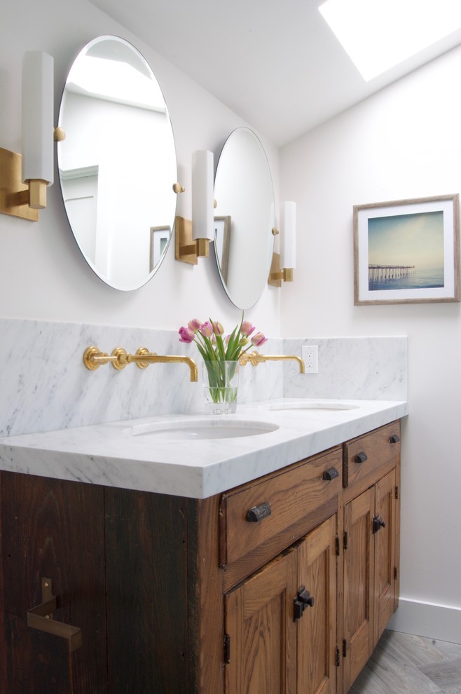 Inspiration for a mid-sized contemporary master white tile and ceramic tile ceramic tile walk-in shower remodel in San Francisco with furniture-like cabinets, distressed cabinets, a two-piece toilet, white walls, an undermount sink and marble countertops