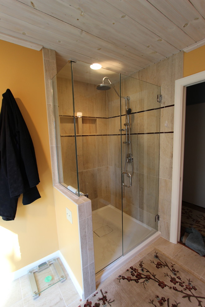 Corner shower - mid-sized contemporary master beige tile and glass tile ceramic tile corner shower idea in Cleveland with a vessel sink, flat-panel cabinets, dark wood cabinets, quartz countertops, a two-piece toilet and yellow walls
