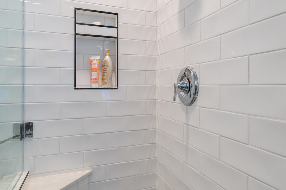 Large minimalist master white tile and subway tile mosaic tile floor and gray floor bathroom photo in Miami with shaker cabinets, white cabinets, a one-piece toilet, gray walls, a console sink, marble countertops, a hinged shower door and white countertops