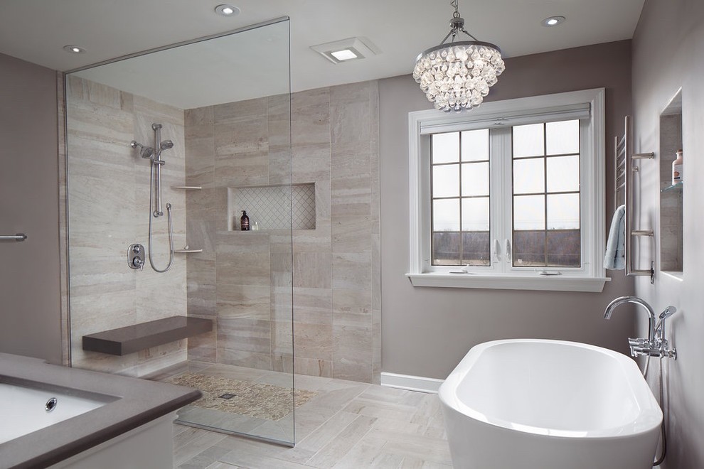 На фото: ванная комната в современном стиле с отдельно стоящей ванной, серой плиткой, керамогранитной плиткой, серыми стенами и полом из керамогранита