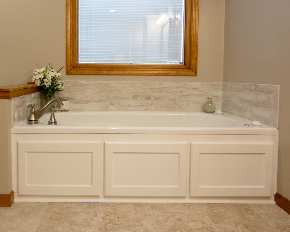 Bathroom - mid-sized traditional master beige tile and porcelain tile porcelain tile and beige floor bathroom idea in Other with recessed-panel cabinets, white cabinets, a two-piece toilet, gray walls, an undermount sink, quartz countertops and white countertops