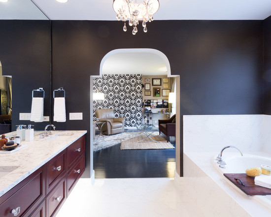 Inspiration for a medium sized traditional ensuite bathroom in Chicago with beaded cabinets, medium wood cabinets, a built-in bath, an alcove shower, a one-piece toilet, black and white tiles, porcelain tiles, black walls, marble flooring, a submerged sink and marble worktops.