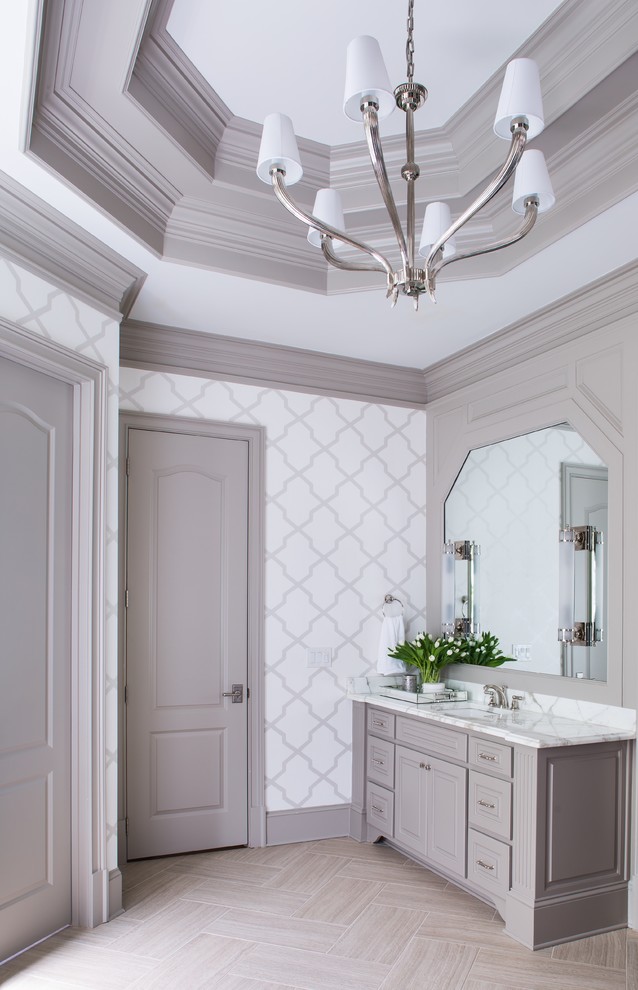 Photo of a medium sized traditional ensuite bathroom in Atlanta with grey cabinets, beige tiles, cement tiles, marble worktops, a freestanding bath, a corner shower, white walls, porcelain flooring, a submerged sink and raised-panel cabinets.