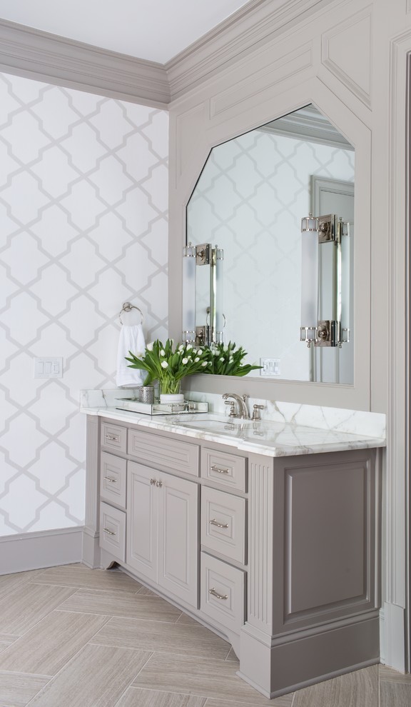 Example of a mid-sized transitional master beige tile and cement tile porcelain tile bathroom design in Atlanta with beaded inset cabinets, gray cabinets, marble countertops, gray walls and an undermount sink
