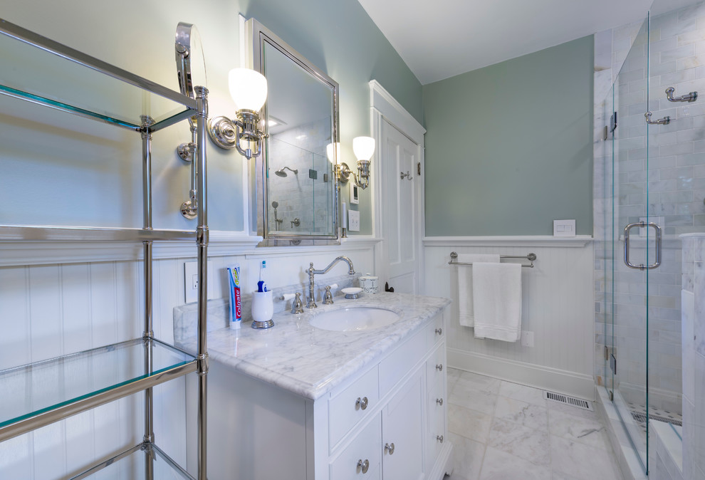 This is an example of a medium sized classic ensuite bathroom in Cincinnati with a submerged sink, recessed-panel cabinets, white cabinets, marble worktops, a built-in bath, a corner shower, white tiles, metro tiles, green walls, marble flooring and a two-piece toilet.