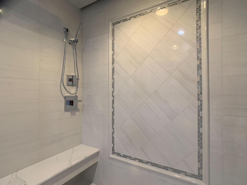 Huge transitional master white tile and porcelain tile porcelain tile and white floor bathroom photo in Bridgeport with raised-panel cabinets, white cabinets, a one-piece toilet, gray walls, a vessel sink, quartz countertops, a hinged shower door and white countertops