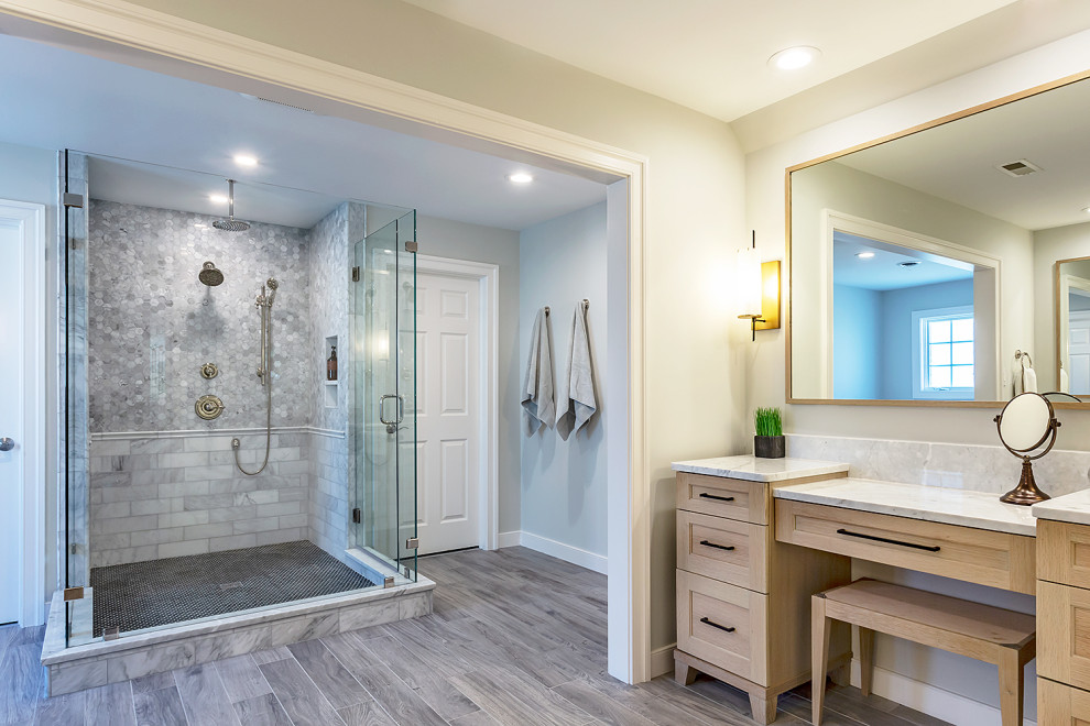 Large transitional master ceramic tile and gray floor bathroom photo in Richmond with furniture-like cabinets, light wood cabinets, a one-piece toilet, gray walls, an undermount sink, granite countertops, a hinged shower door and white countertops