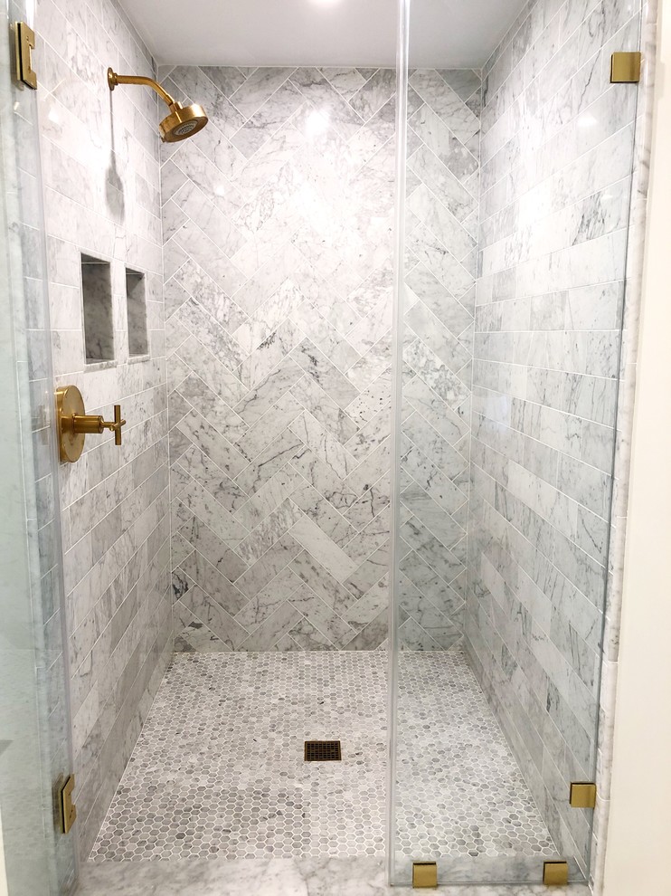 Elegant master gray tile and marble tile marble floor and gray floor bathroom photo in Boston with a one-piece toilet, an undermount sink, a hinged shower door and white countertops