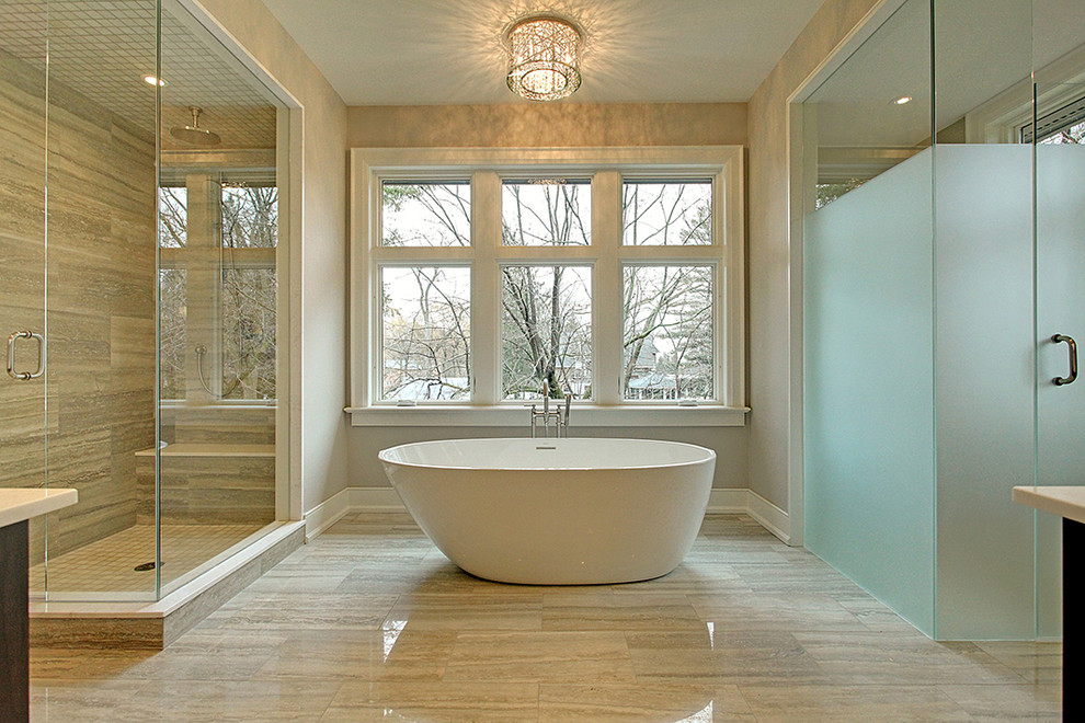 На фото: главная ванная комната среднего размера в стиле неоклассика (современная классика) с отдельно стоящей ванной, серыми стенами, полом из керамогранита, плоскими фасадами, темными деревянными фасадами, душевой комнатой и врезной раковиной с