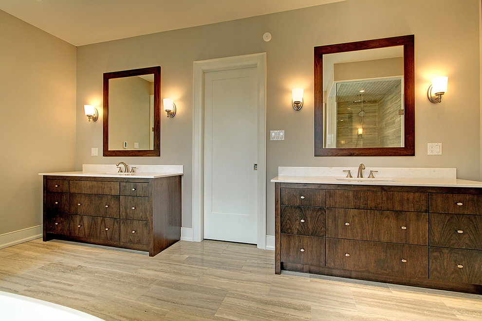 Medium sized classic ensuite wet room bathroom in Toronto with flat-panel cabinets, dark wood cabinets, a freestanding bath, grey walls, porcelain flooring and a submerged sink.